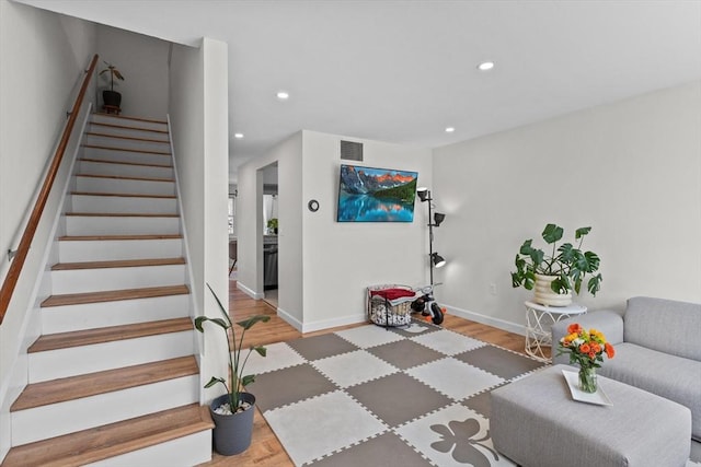 5257 Washington St Unit 5257, Boston, MA 02132 - living area featuring light wood finished floors, recessed lighting, stairway, and baseboards