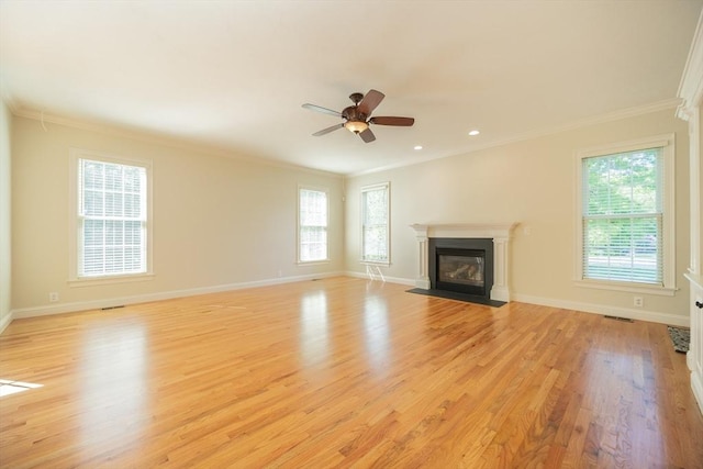 2 Pine Ridge Ln, Mattapoisett, MA 02739 - unfurnished living room with a fireplace with flush hearth, crown molding, light wood-style floors, baseboards, and ceiling fan