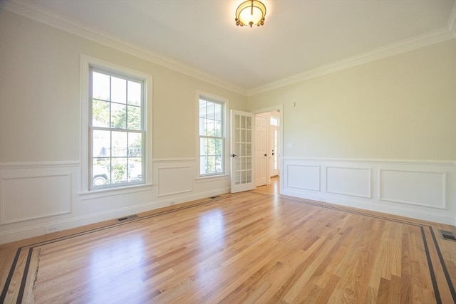 2 Pine Ridge Ln, Mattapoisett, MA 02739 - spare room with light wood-type flooring, crown molding, and a wainscoted wall