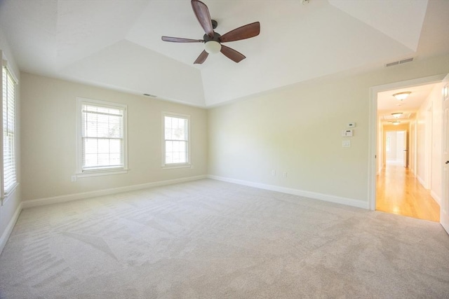 2 Pine Ridge Ln, Mattapoisett, MA 02739 - spare room with light colored carpet, a ceiling fan, a raised ceiling, lofted ceiling, and baseboards