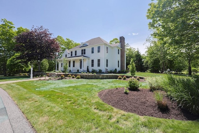 2 Pine Ridge Ln, Mattapoisett, MA 02739 - colonial-style house featuring a chimney and a front yard