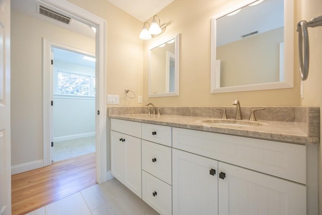 2 Pine Ridge Ln, Mattapoisett, MA 02739 - bathroom with double vanity, baseboards, and wood finished floors