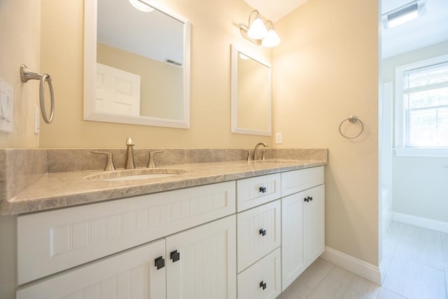 2 Pine Ridge Ln, Mattapoisett, MA 02739 - bathroom with double vanity and baseboards