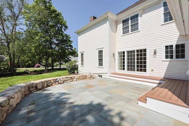 2 Pine Ridge Ln, Mattapoisett, MA 02739 - rear view of property with a chimney, a patio area, and a yard