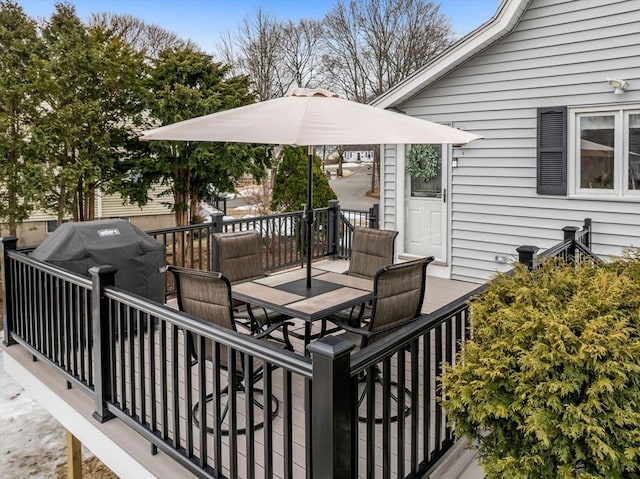 wooden deck with outdoor dining space