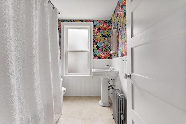 17 Atlantic St, Boston, MA 02127 - full bath featuring radiator heating unit, toilet, a wainscoted wall, and curtained shower