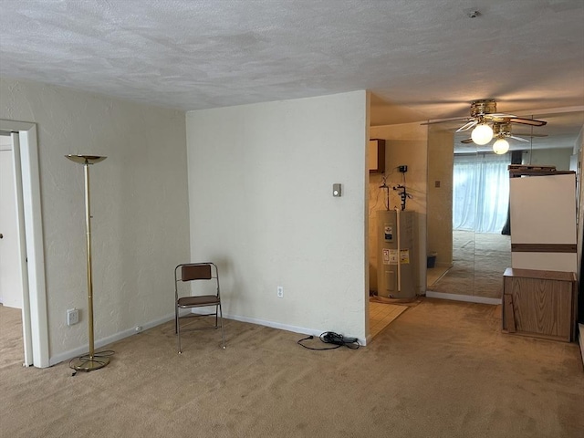 188 Swanson Rd Unit 331, Boxborough, MA 01719 - spare room featuring water heater, carpet flooring, a textured ceiling, ceiling fan, and baseboards