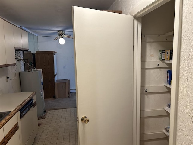188 Swanson Rd Unit 331, Boxborough, MA 01719 - kitchen featuring dishwasher, water heater, a ceiling fan, a baseboard heating unit, and white cabinets
