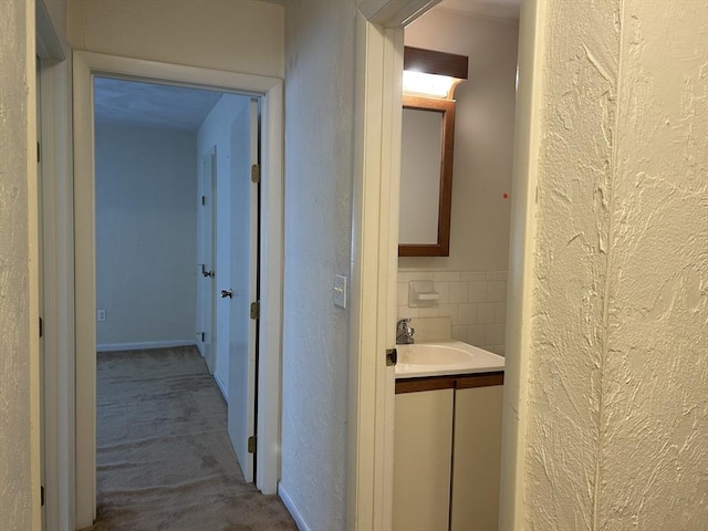 188 Swanson Rd Unit 331, Boxborough, MA 01719 - corridor featuring a sink, carpet flooring, and a textured wall