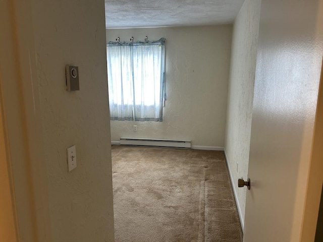 188 Swanson Rd Unit 331, Boxborough, MA 01719 - carpeted empty room featuring baseboard heating, a textured wall, baseboards, and a textured ceiling