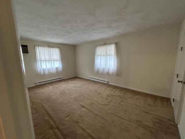 188 Swanson Rd Unit 331, Boxborough, MA 01719 - unfurnished room featuring baseboard heating, carpet flooring, baseboards, and a textured ceiling