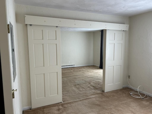 188 Swanson Rd Unit 331, Boxborough, MA 01719 - carpeted spare room with a baseboard heating unit, baseboards, and a textured wall