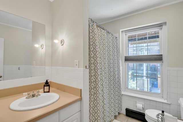 bathroom with tile walls, toilet, ornamental molding, and vanity