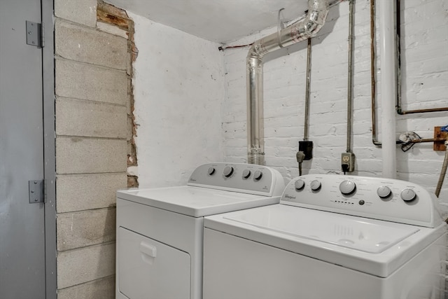 laundry area with washing machine and dryer