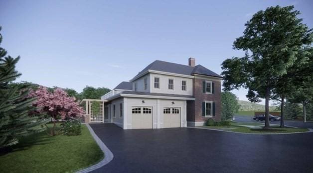 view of front property with a garage and a front yard