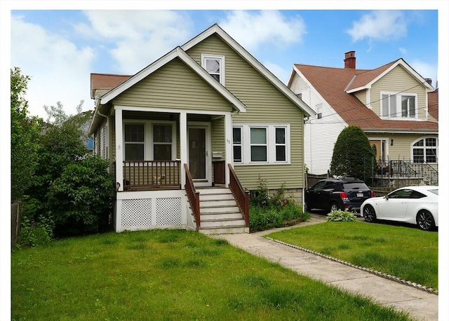 95AKA93 Lynnway, Revere, MA 02151 - bungalow featuring covered porch and a front lawn