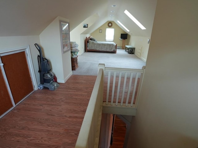 95AKA93 Lynnway, Revere, MA 02151 - bedroom featuring vaulted ceiling, a skylight, wood finished floors, and baseboards