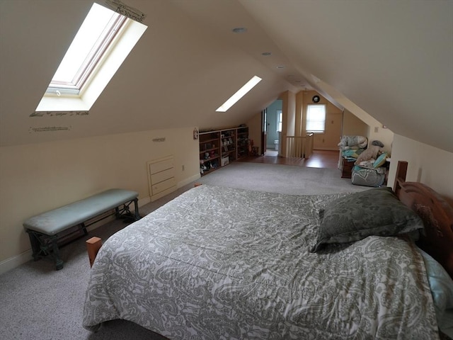 95AKA93 Lynnway, Revere, MA 02151 - bedroom featuring a skylight, carpet floors, vaulted ceiling, and baseboards