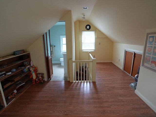 95AKA93 Lynnway, Revere, MA 02151 - bonus room featuring lofted ceiling, wood finished floors, and baseboards