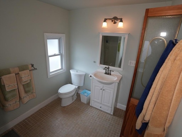 95AKA93 Lynnway, Revere, MA 02151 - bathroom with vanity, toilet, tile patterned floors, and baseboards