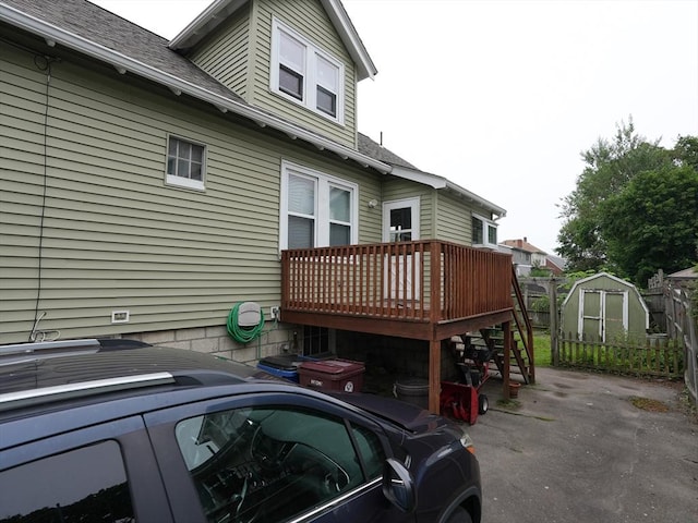 95AKA93 Lynnway, Revere, MA 02151 - view of property exterior with a deck and a shingled roof