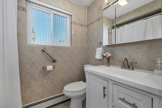 bathroom with a baseboard radiator, toilet, tile walls, vanity, and tile patterned floors