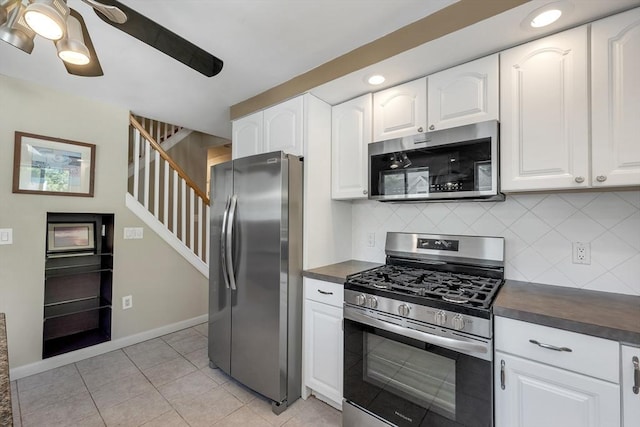 kitchen with appliances with stainless steel finishes, decorative backsplash, white cabinets, recessed lighting, and light tile patterned floors