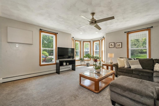living area with healthy amount of natural light, carpet floors, ceiling fan, a baseboard heating unit, and recessed lighting