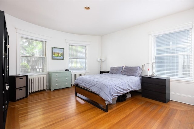 51 Naples, Brookline, MA 02446 - bedroom featuring radiator heating unit and light wood-style flooring
