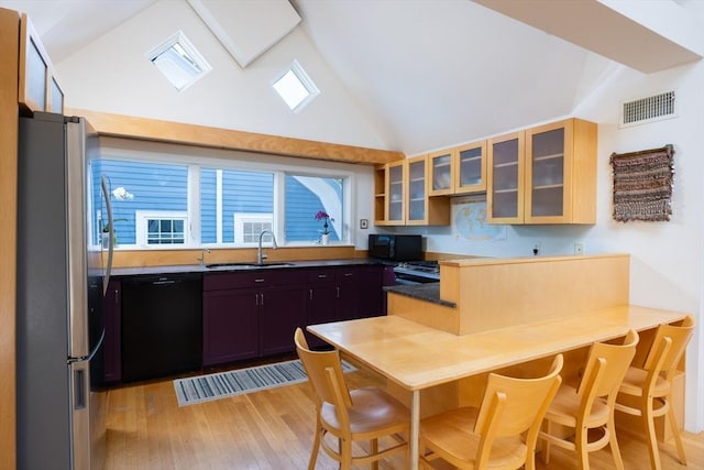 51 Naples, Brookline, MA 02446 - kitchen featuring black appliances, light wood finished floors, glass insert cabinets, and high vaulted ceiling