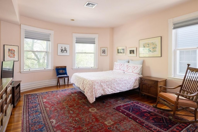 51 Naples, Brookline, MA 02446 - bedroom with dark wood-style flooring and multiple windows