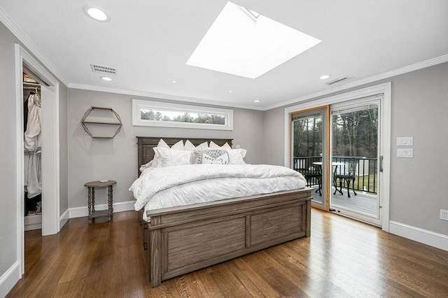 bedroom with a skylight, ornamental molding, dark hardwood / wood-style floors, and access to exterior