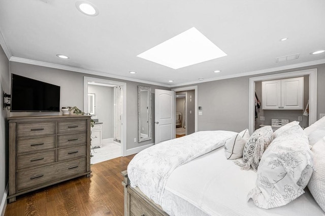 bedroom featuring ensuite bath, dark hardwood / wood-style flooring, ornamental molding, and a skylight