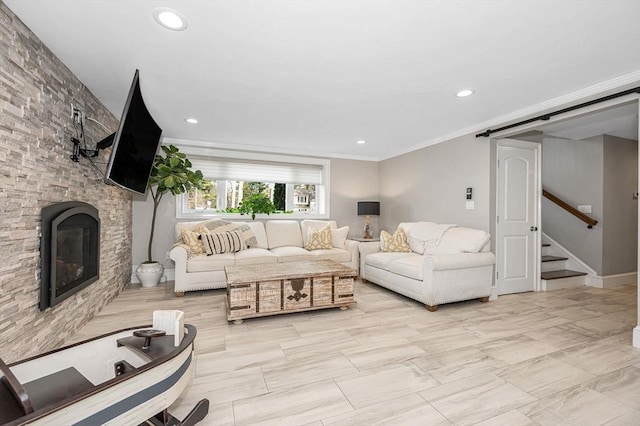 living room featuring a stone fireplace and ornamental molding