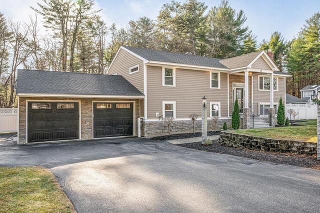 bi-level home featuring a garage