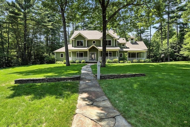 19 Hawthorn Rd, Amherst, MA 01002 - view of front facade featuring covered porch and a front yard