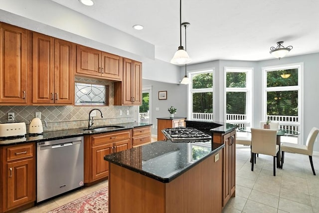 19 Hawthorn Rd, Amherst, MA 01002 - kitchen featuring stainless steel appliances, a kitchen island, light tile patterned floors, decorative backsplash, and dark stone counters