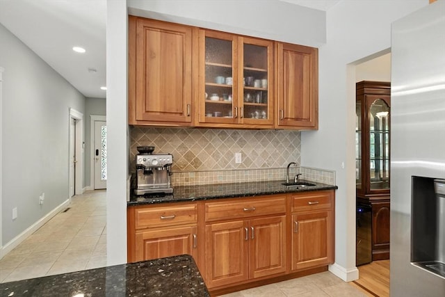 19 Hawthorn Rd, Amherst, MA 01002 - bar area featuring stainless steel fridge, light tile patterned floors, backsplash, and recessed lighting