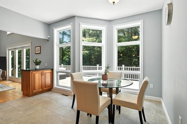 19 Hawthorn Rd, Amherst, MA 01002 - dining area with light tile patterned floors and baseboards