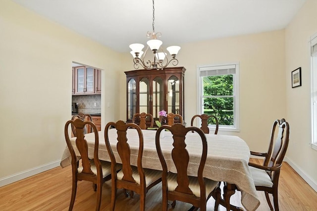 19 Hawthorn Rd, Amherst, MA 01002 - dining area featuring a chandelier and light wood-style flooring