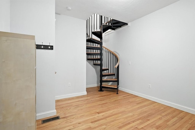 19 Hawthorn Rd, Amherst, MA 01002 - staircase featuring wood finished floors and baseboards