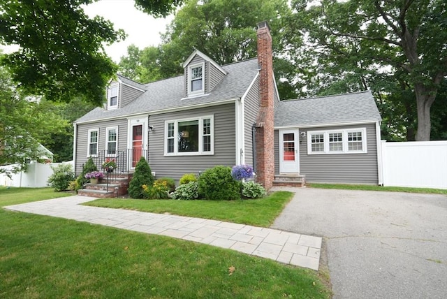99 Edgehill Rd, Norwood, MA 02062 - cape cod home featuring a chimney, driveway, and roof with shingles