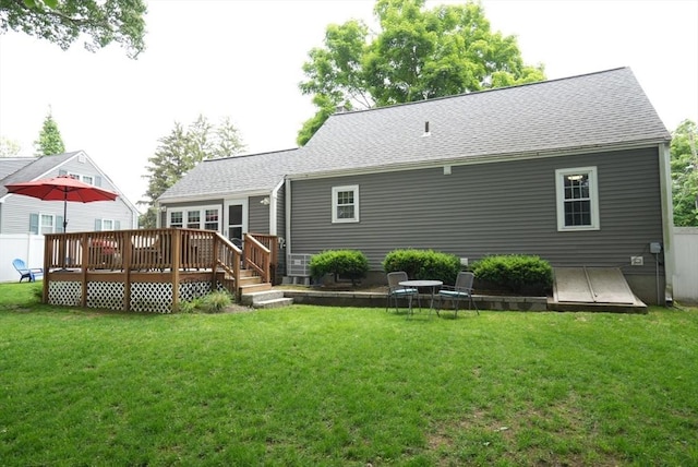 99 Edgehill Rd, Norwood, MA 02062 - back of property with a deck, a yard, and roof with shingles
