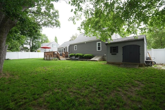 99 Edgehill Rd, Norwood, MA 02062 - rear view of property featuring a deck, a fenced backyard, and a storage shed