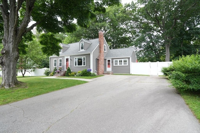 99 Edgehill Rd, Norwood, MA 02062 - cape cod-style house featuring driveway, a chimney, and a shingled roof