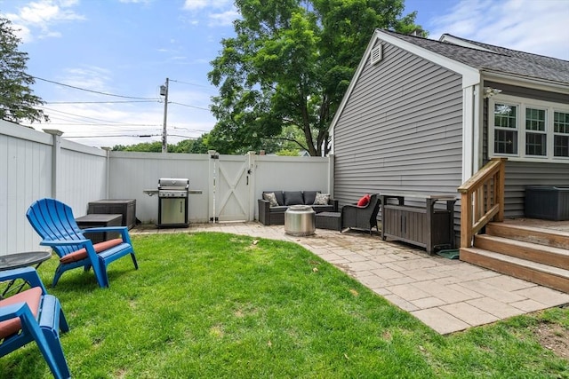 99 Edgehill Rd, Norwood, MA 02062 - fenced backyard with an outdoor hangout area, a gate, and a patio area