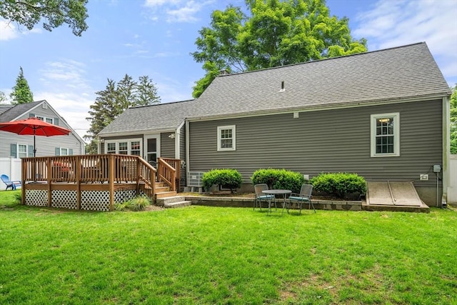 99 Edgehill Rd, Norwood, MA 02062 - rear view of house featuring a wooden deck, a lawn, and roof with shingles