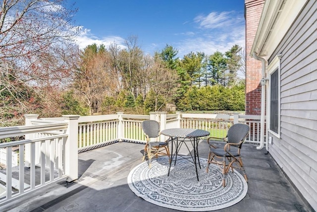 wooden deck with outdoor dining area