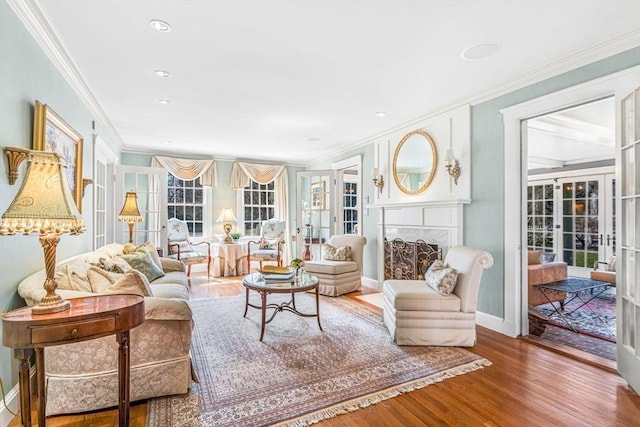 sunroom featuring a fireplace, a wealth of natural light, and french doors