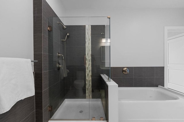 full bath with a garden tub and a shower stall